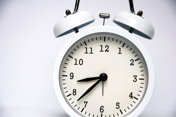 White alarm clock isolated on white background