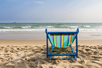 Beach chair on the beach and sea background