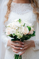 Obraz na płótnie Canvas nice wedding bouquet in bride's hand