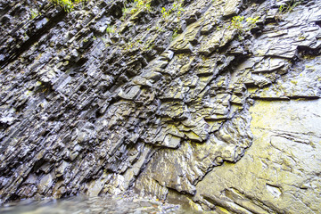 Layers of rocks under the influence of long-term water. Background