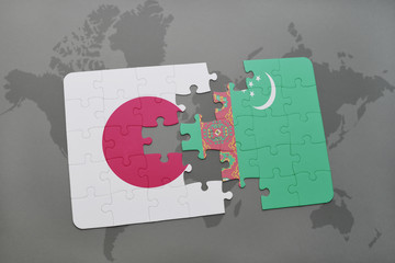 puzzle with the national flag of japan and turkmenistan on a world map background.