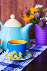 Tea set on the dark blue tablecloth