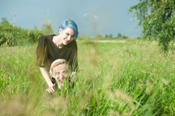 man and woman with dyed hair romantically spend time in nature. romantic couple in love outdoors