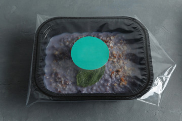 Dietary food in the container on the concrete background