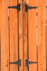 knotted wooden picket fence and gate and hinges