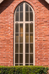 Fototapeta na wymiar tall and narrow chapel window with gothic top shape