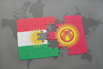 puzzle with the national flag of kurdistan and kyrgyzstan on a world map background.