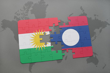 puzzle with the national flag of kurdistan and laos on a world map background.