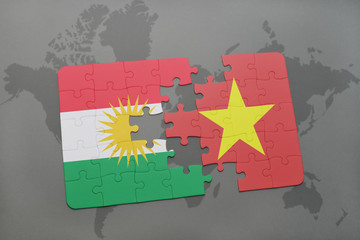 puzzle with the national flag of kurdistan and vietnam on a world map background.
