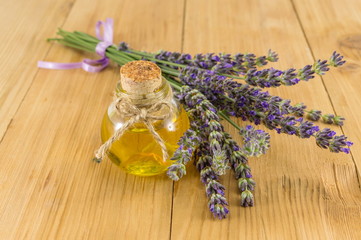 Lavender oil with fresh flower branches