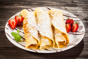 Crepes with strawberries and cream 