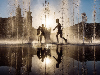 Children playing in a fountain
