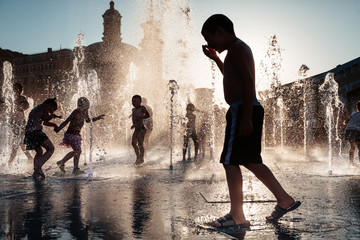 Children playing in a fountain