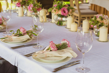 flower composition and candles in the restaurant. Wedding dinner