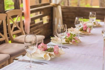 flower composition and candles in the restaurant. Wedding dinner