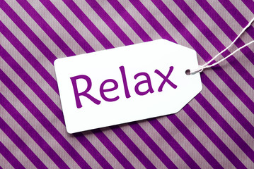 Label On Purple Wrapping Paper, Text Relax