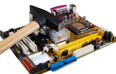 Circuit board of computer components and hammer.