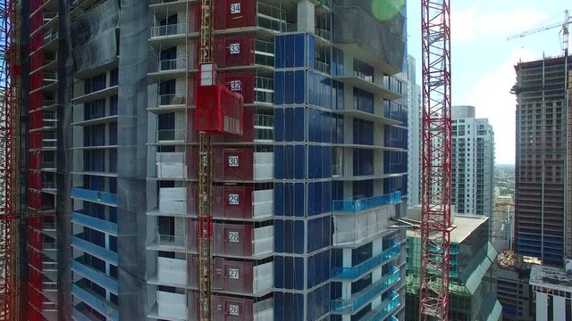 4K AERIAL - Building in construction / freight elevator