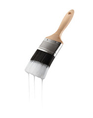 Paintbrush loaded with white color dripping off the bristles. Isolated on white background.