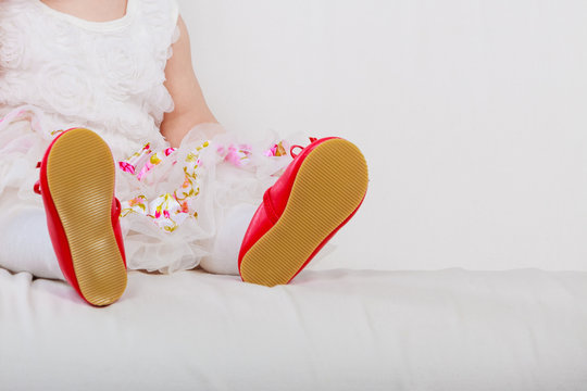 Little girl with red shoes