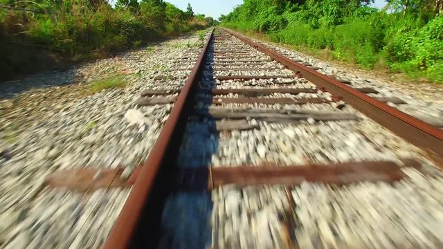 AERIAL - Closeup on train tracks going up in the sky. 
