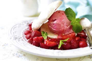 Strawberry dessert with coconut meringue,ice cream and strawberr