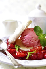Strawberry dessert with coconut meringue,ice cream and strawberr