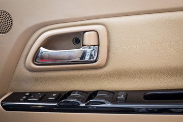 Door handle inside the luxury modern car on switch button control