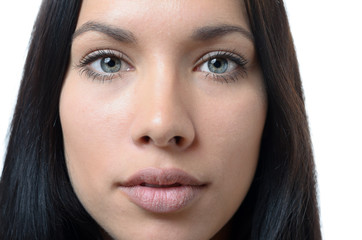 Fototapeta premium Close up of the face of a serious young woman
