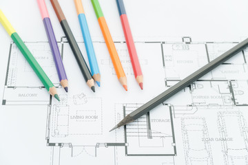 architects workplace - architectural blueprints, architectural drawings of the modern house with color pencils .decoration concept. designer tools.