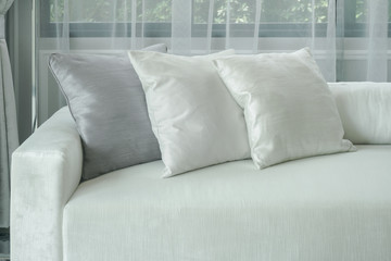 White pillows lay on sofa in modern style living room