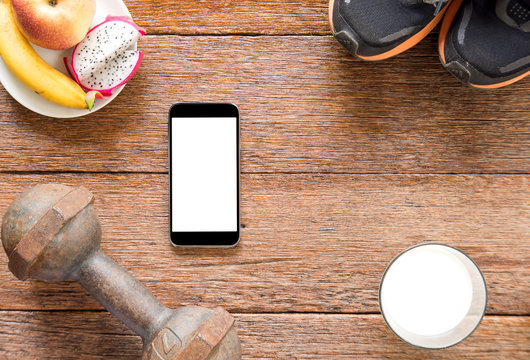 Iron dumbbell,Sports shoes and smart phone with milk and Iron du