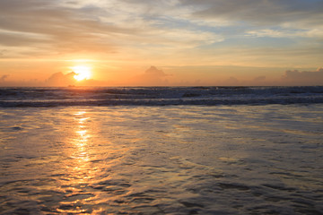 Fototapeta na wymiar beautiful sunrise dramatic sky with colorful cloud on sea