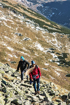 Young woman with son on the mountain footpath