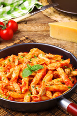 Penne with roasted chicken in tomato sauce