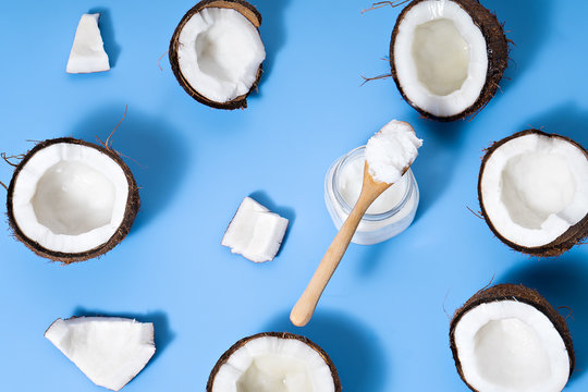 coconuts with coconut oil  on blue table