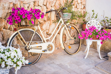 Fototapeta na wymiar Vintage bicycle with flowers in an basket