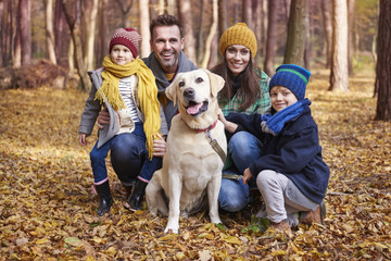 Portrait of happy family during the autumn