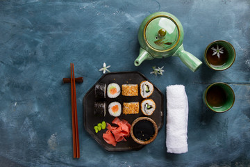 Sushi rolls set with green tea