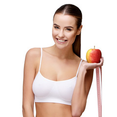 portrait of attractivesmiling woman holding apple isolated on white