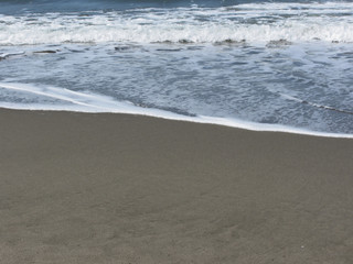 Wave of the sea on the sand beach. Forte dei marmi, Province of Lucca, Italy