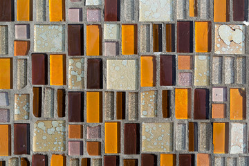 Colorful mosaic on the wall, abstract glass background.