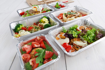 Healthy food in boxes, diet concept.