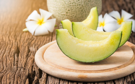 Sliced Japan Melon On Wood Plate