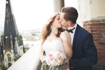 Gorgeous wedding couple walking in the old city of Lviv