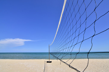 Clear Blue Sky and Sunny on the beach.
Umbrella, Bed, Volleyball Net all activity on the beach with sunny day, clear and blue sky, sea and white sand.