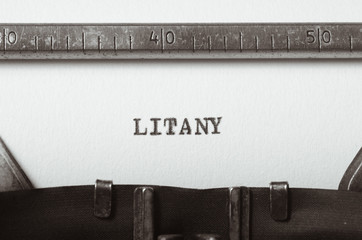 word litany typed on typewriter