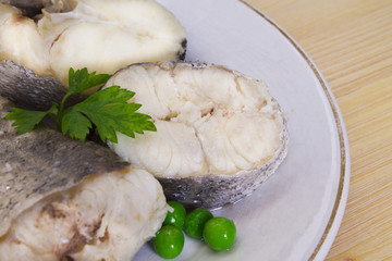 fresh hake on wooden background