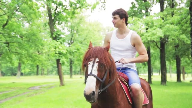 Man on a horse in the park, ow Motion