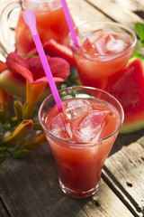 watermelon juice on wooden background